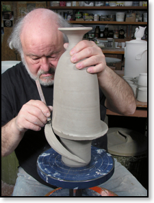 Robin Hopper trimming a parabolic bottle.